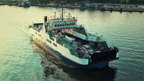 Camera-moving-above-the-ferry-crossing-the-channel-full-of-cars-and-people