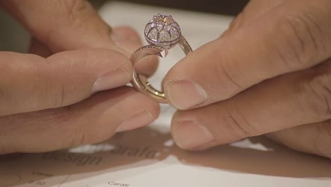 italian goldsmith at work building an engagement or a wedding ring