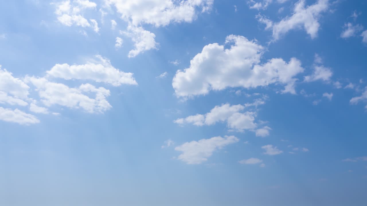timelapse footage of Blue sky white clouds. Puffy fluffy white clouds. Cumulus cloud cloudscape timelapse, colorful nature sunlight Summer clear weather and White clouds in spring season in tropical