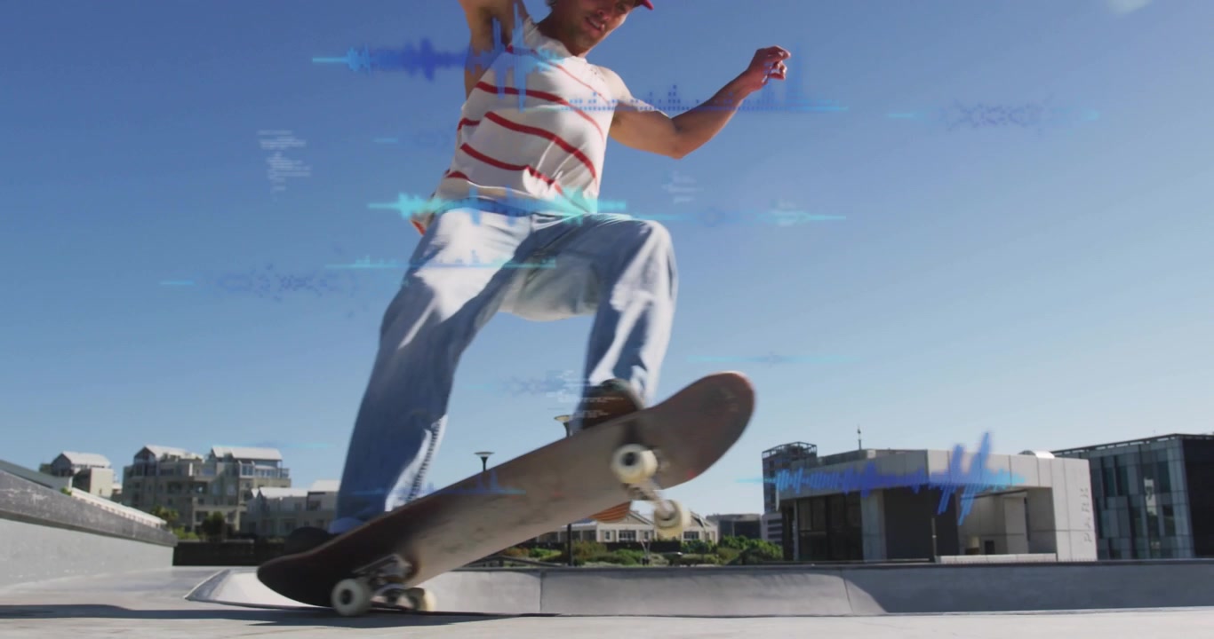 Male skateboarder pushing and starting truck sliding across urban plaza ledge for trick landing