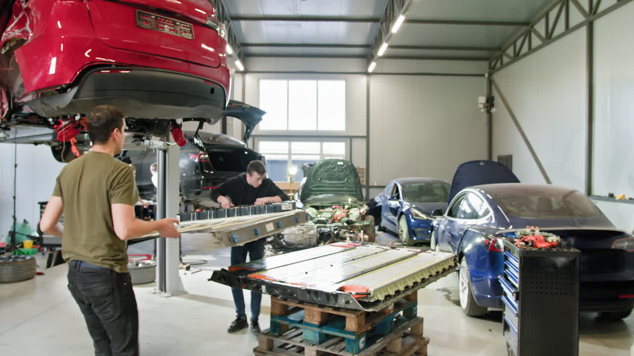 Electric Car Battery Replacement in a Workshop