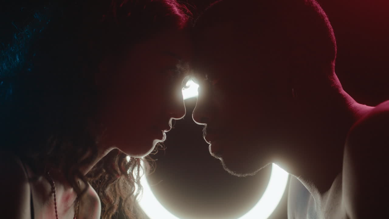 Loving Couple Head to Head under Neon Light