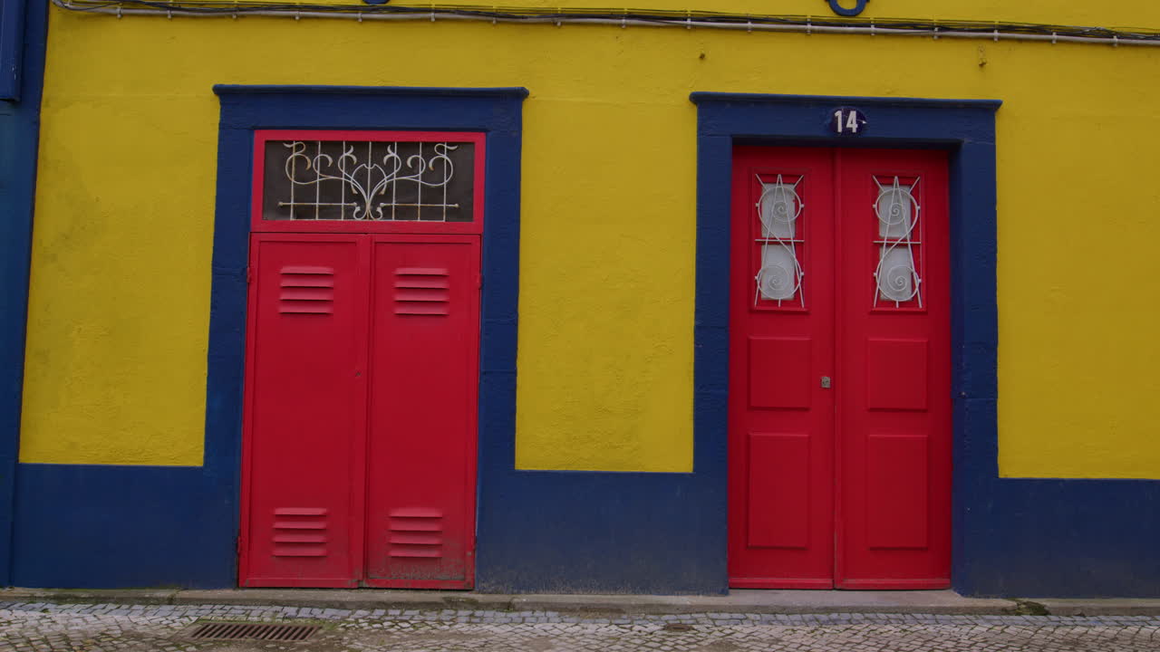 Yellow Building With Red Doors In Aveiro, Portugal. Static shot