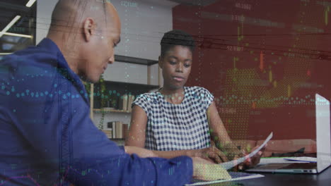animation of financial data processing over diverse man and woman discussing over a document
