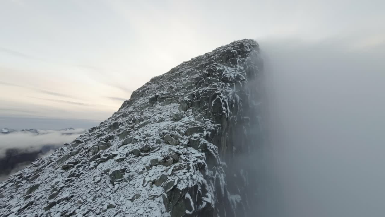 Ascending the partialle cloud covered Store Bl&aring;mann in northern Norway