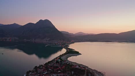 Aerial-Footage-Of-Egirdir-City-Situated-on-Narrow-Peninsula-And-Egirdir-Lake-At-Evening-Dawn