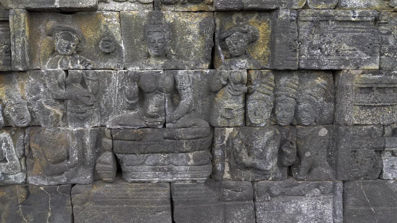 Indonesia,Jawa Island,Yogyakarta, Unesco world heritage Borobudur Temple's inside, wall relief close up. camera slides slowly from left to right and shows the relief in details