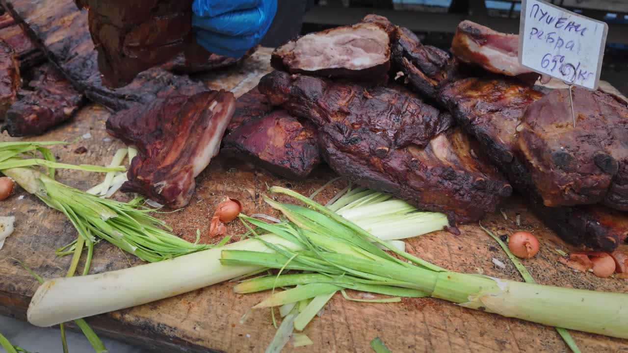 BBQ Smoked pork spareribs displayed on festival food stall