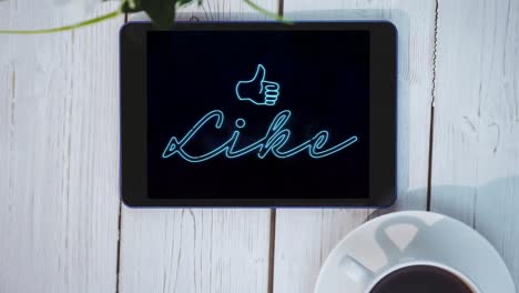 Animation-of-blue-neon-style-word-Like-with-an-icon-flickering-on-screen-of-a-digital-tablet