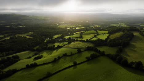 aerial view of lush green fields and valley