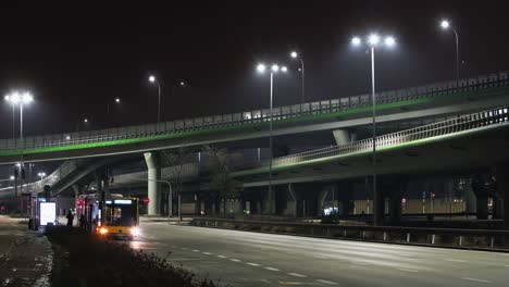 timelapse traffic interchange road in evening, modern roadway intersection in warsaw city at night. cars driving junction highway in fast motion. multilevel expressway shot in time-lapse