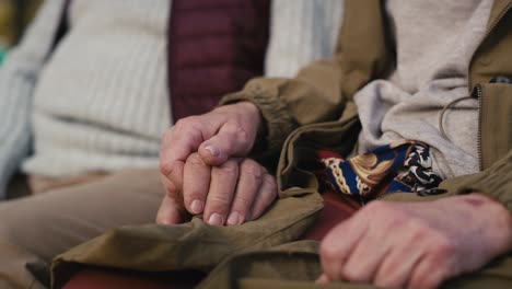 Part-of-caucasian-couple-holding-hands-together