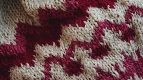 Texture-of-knitted-sweater-with-white-and-red-colors,-close-up-view