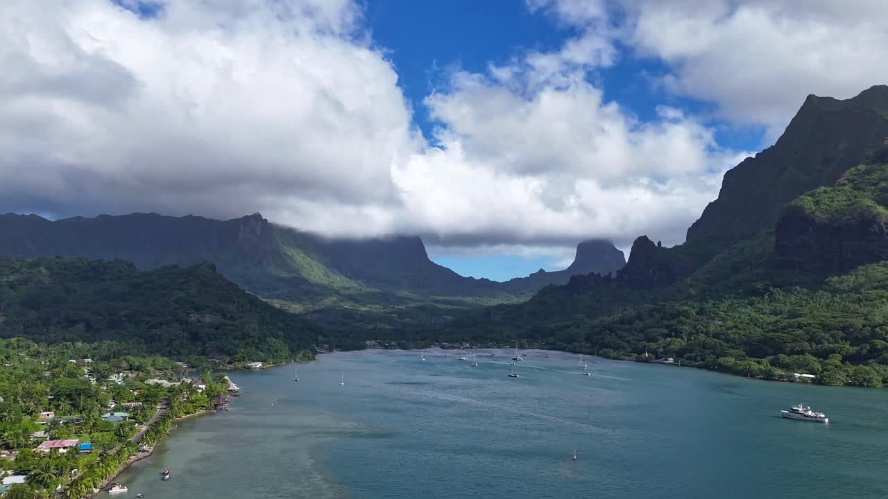 Breathtaking Tropical Island Bay with Lush Mountains and Calm Ocean