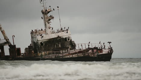 rusty shipwreck on a stormy coastline