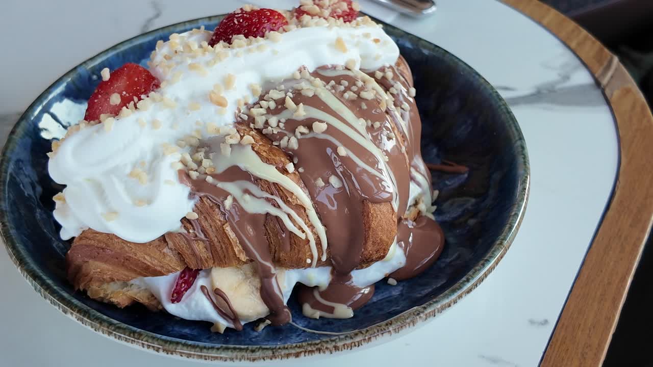 Gourmet Croissant with Chocolate, Strawberries, and Whipped Cream