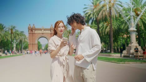 closeup tourist couple searching direction with phone. happy couple checking way