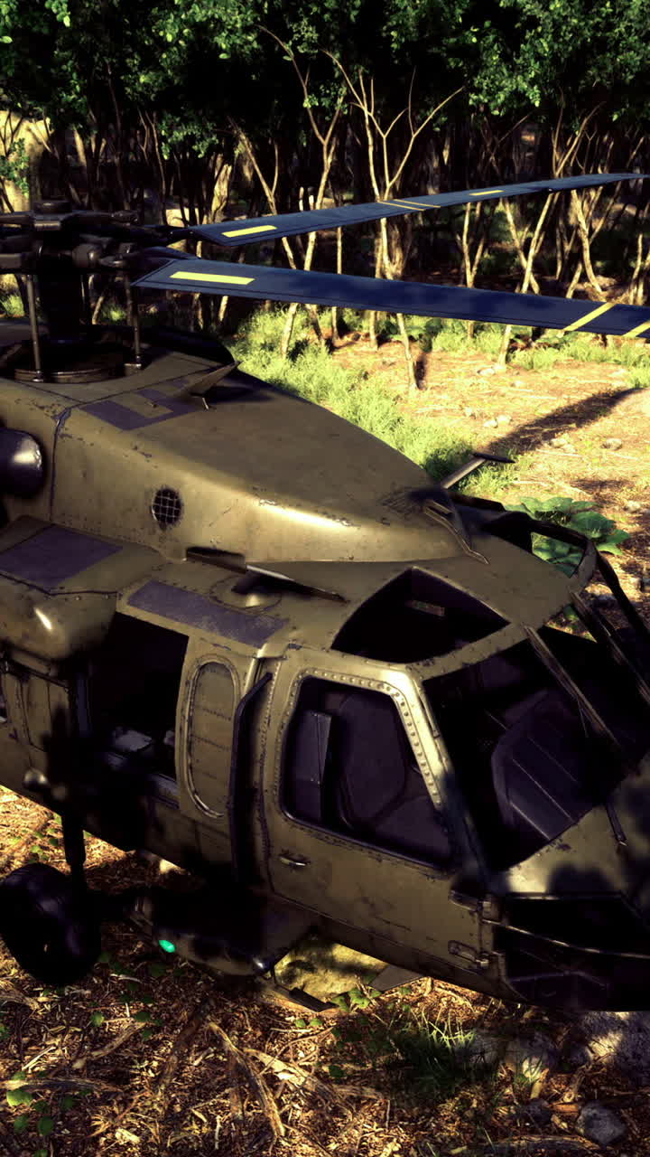 Military helicopter resting among lush green trees in a forest