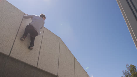 Caucasian-man-practicing-parkour