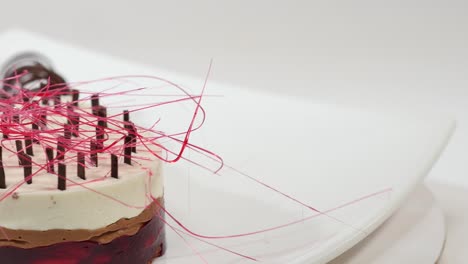 elegant multi-layered dessert with chocolate and cherry