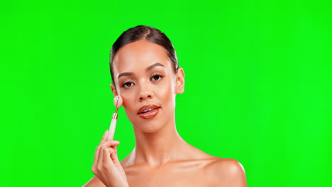 beauty, facial roller and woman portrait on green