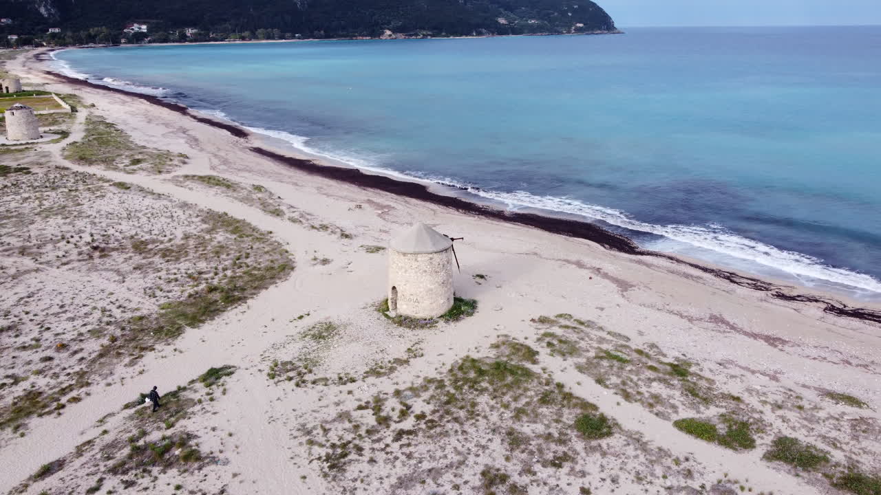 Old Abandoned Wind Mill at the Beach in Lefkada, Greece - Aerial Orbit