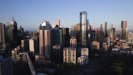 aerial view in front of the northside of melbourne skyline, dramatic golden hour
