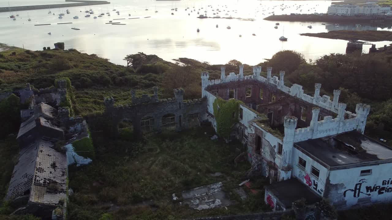 Soldiers point house aerial view abandoned overgrown Holyhead coastal Victorian mansion at sunrise