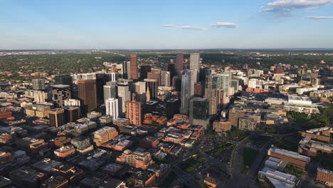 drone descending in front of the downtown denver skyline , sunrise in co, usa