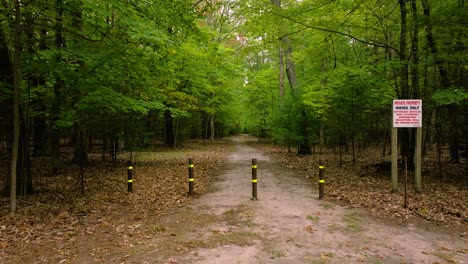 the entrance to a hiking trail on a cloudy day