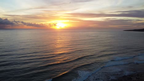 glowing bright sunset over spain coastline to atlantic ocean, aerial view