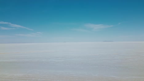 discover the enchanting allure of bolivia's salar de uyuni with breathtaking drone footage showcasing the endless salt flats from an aerial view