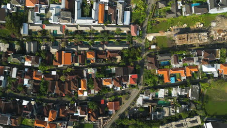 Aerial-over-Canggu,-Bali,-Indonesia,-showing-the-increased-urban-expansion-due-to-unrestricted-tourism