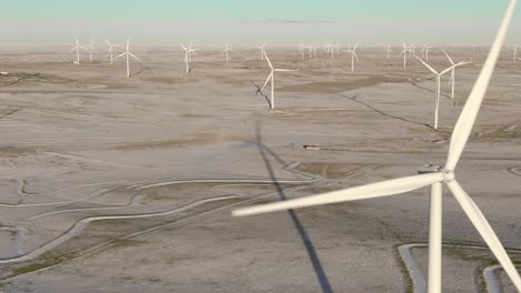 Aerial-shots-of-wind-turbines-on-a-cold-winter-afternoon-in-Calhan,-Colorado