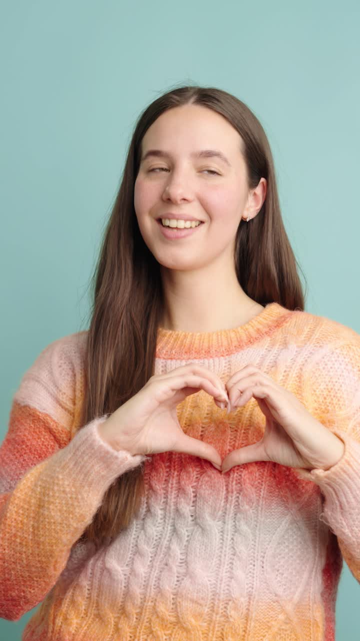 Woman expressing love and happiness with gestures