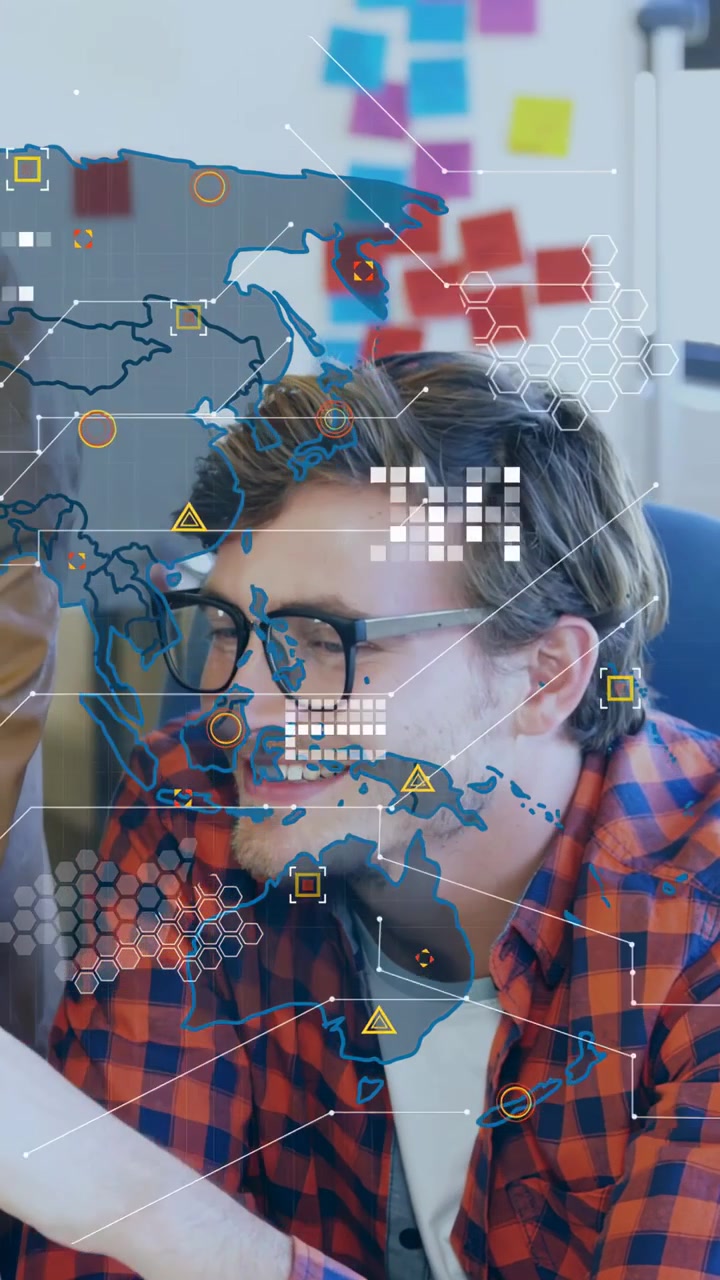 Vertical video: Seated man leaning, HUD appearing, peer joining, both reviewing device for work
