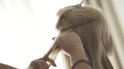 woman getting her hair styled