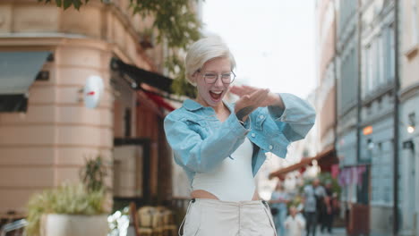 cheerful rich happy woman throwing money around hand gesture more tips earnings on city street