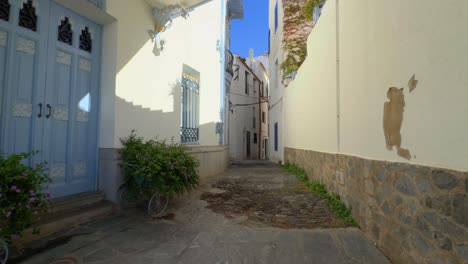 walking through a mediterranean town, white, blue windows, ibizan style