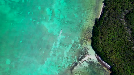 aerial top down ferry boat cruising on caribbean sea mexico tulum travel holiday destination sian kaʼan reserve biosphere reserve