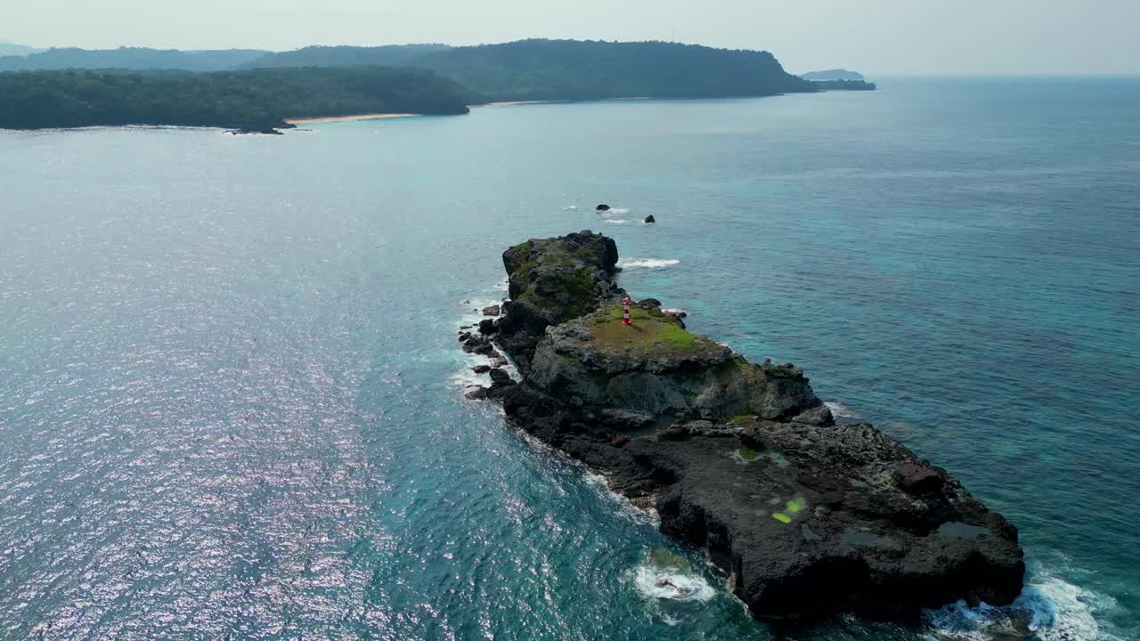 Circular view of the monastery lighthouse located on a rock in front of Boi beach on the island of Principe,Sao Tome,Africa