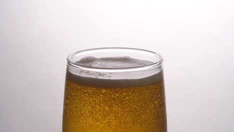 beer in glass, slow motion