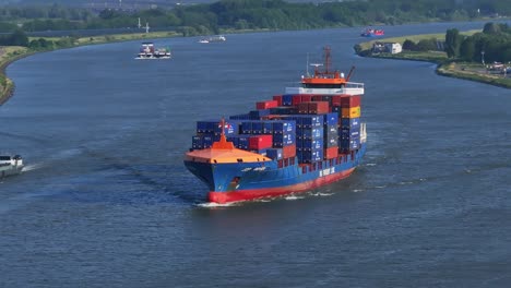 jsp rover container ship heads out to sea along the river