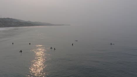 Aerial-Drone-View-Of-Surfers-At-Sunrise-La-Bocana-El-Tunco-El-Salvador