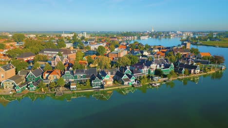 old traditional wooden houses along the river at the zaanse schans, koog aan de zaan, netherlands