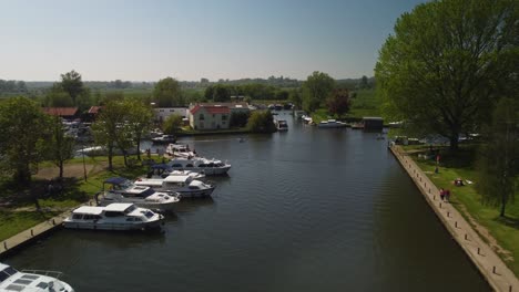 aerial drone footage of along the river waveney over moored boats in beccles, norfolk