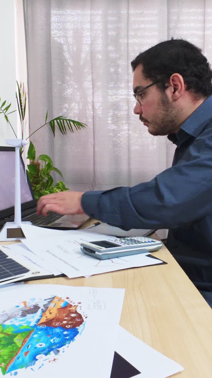 Professional Working in a Modern Green Energy Office