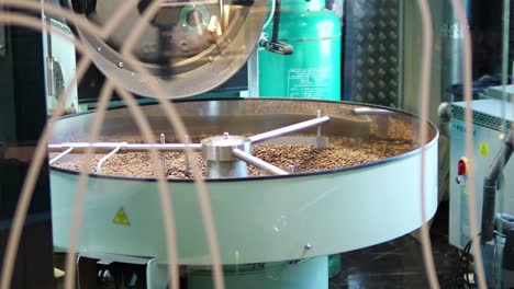 roasting coffee beans coffee shop production process industrial setting close-up view art of coffee making
