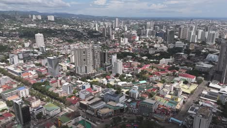 wide angle reveal from fuente circle across cebu city