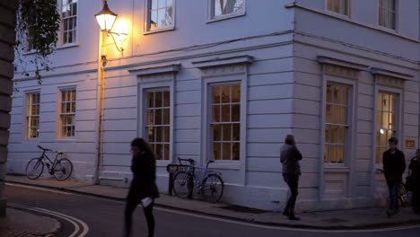 view along street in oxford city centre at dusk